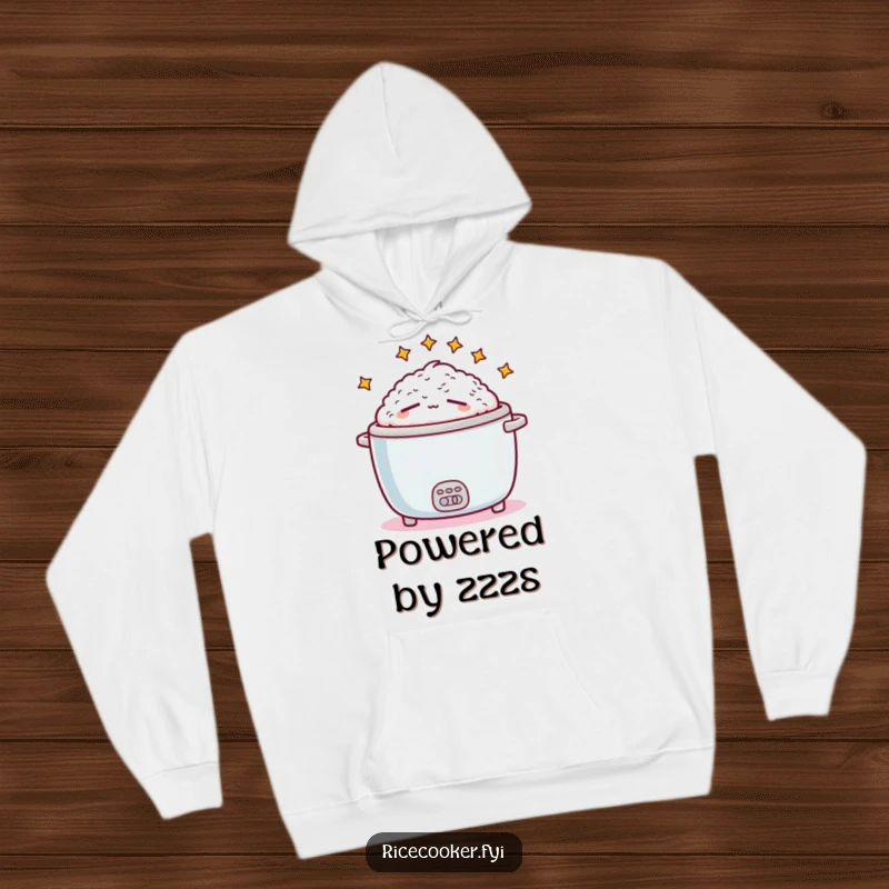 Funny sleepy rice cooker design on a warm hoodie, depicting a tired appliance surrounded by dreamy stars, a perfect funny gift.
