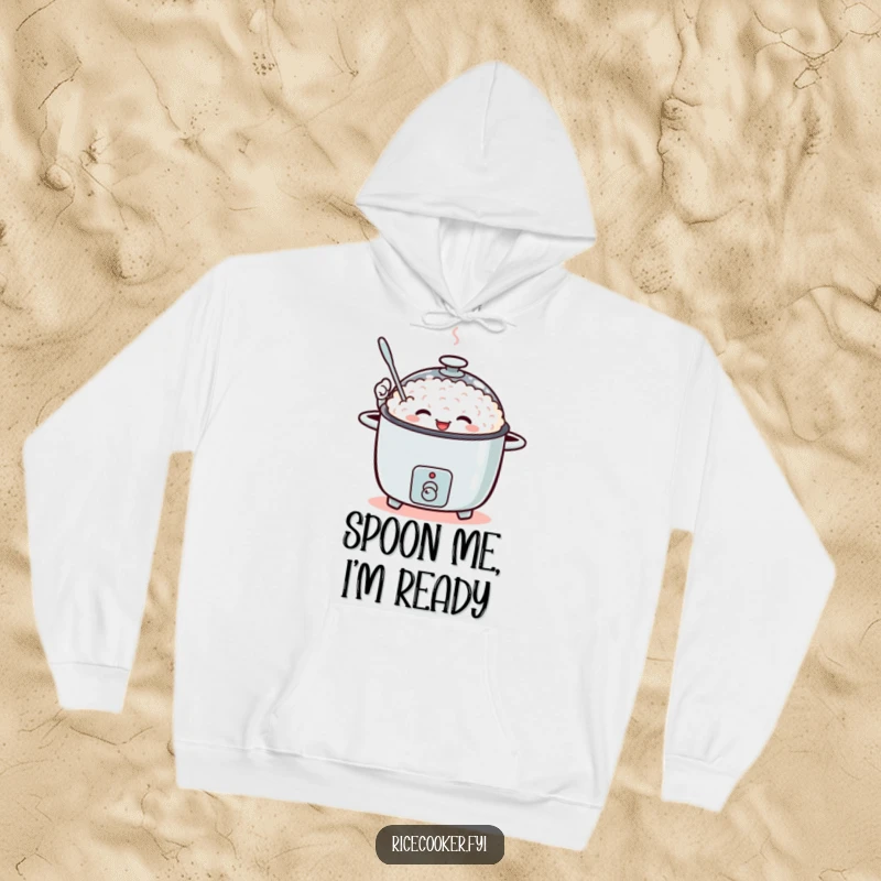 Funny hoodie with a rice cooker character energetically waving a tiny spoon.