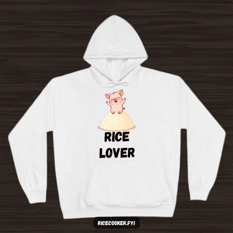 Funny pig hoodie featuring a giggling pig dancing on a pile of perfectly cooked rice, offering warmth and humorous joy.