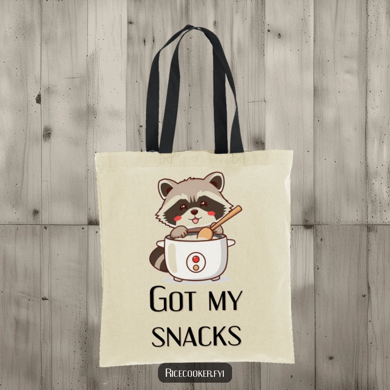 Funny tote bag featuring a mischievous raccoon using a wooden spoon to tap a rice cooker, ready for a midnight snack.